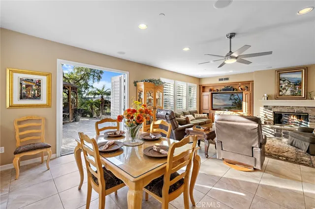 a view of a patio with a table and chairs and potted plants
