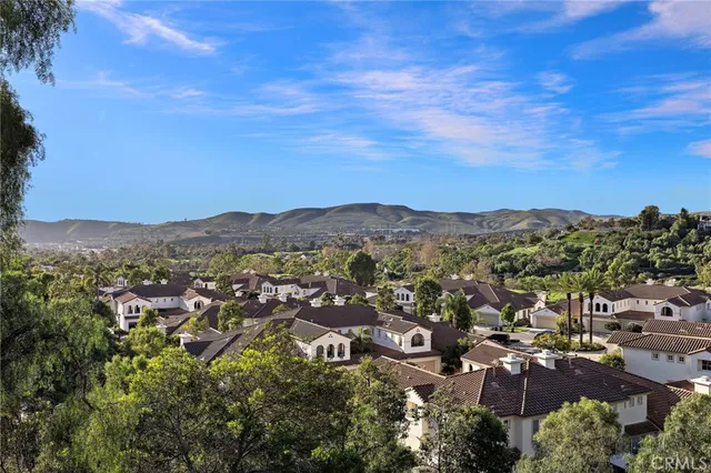 an aerial view of residential building and trees around