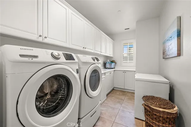 a front view of multi story residential apartment building with yard and green space