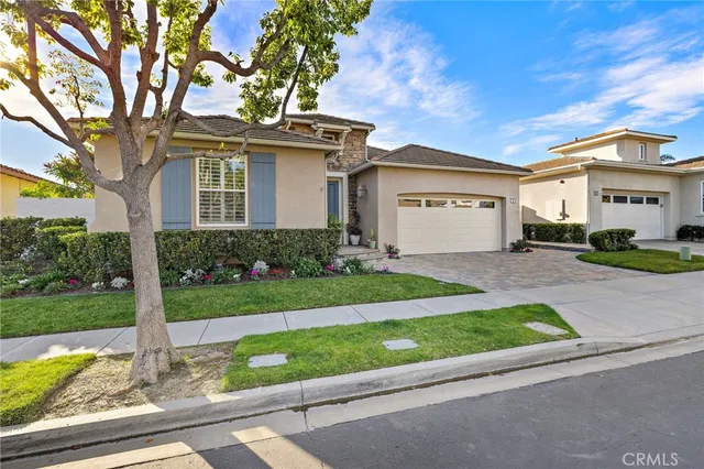 a living room with furniture and flowers