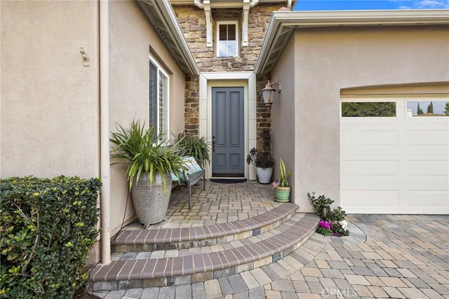 a living room with furniture and flowers