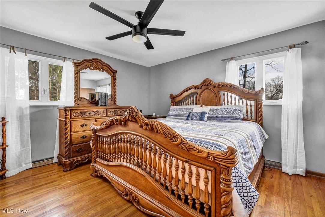 3673 Oak Road Stow, OH 44224 - Photo 9 of 20 Bedroom featuring a ceiling fan, baseboards, and wood finished floors