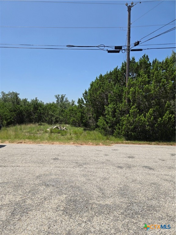 239 George Strait Canyon Lake, TX 78133 - Photo 26 of 31 a view of a swimming pool with an outdoor space and seating area