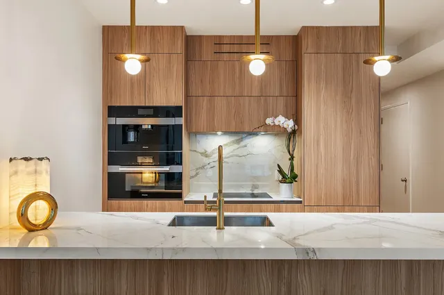 a kitchen with a sink and cabinets