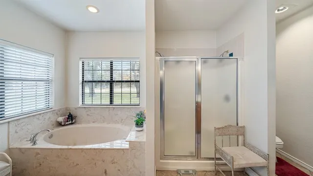 a bath tub sitting next to a window