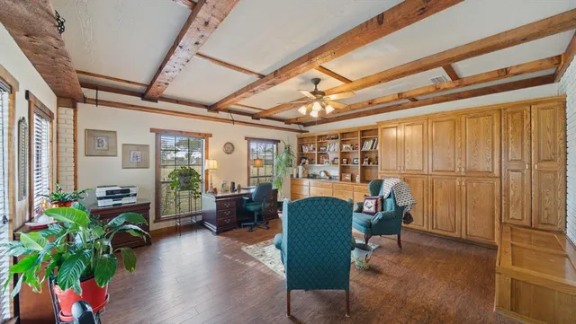 a view of a livingroom with furniture and a window