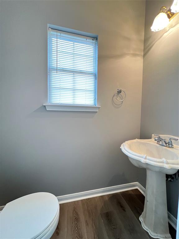 1809 Springwater Drive Round Rock, TX 78681 - Photo 9 of 25 Bathroom with dark wood finished floors and baseboards