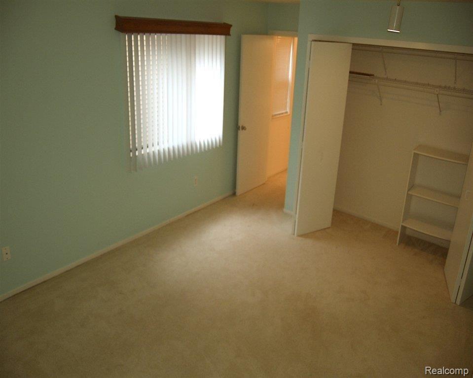 6540 Ridgefield Circle, Unit 101 West Bloomfield, MI 48322 - Photo 16 of 18 1st M Bedroom.JPG