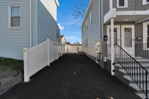 a view of a house with backyard and porch