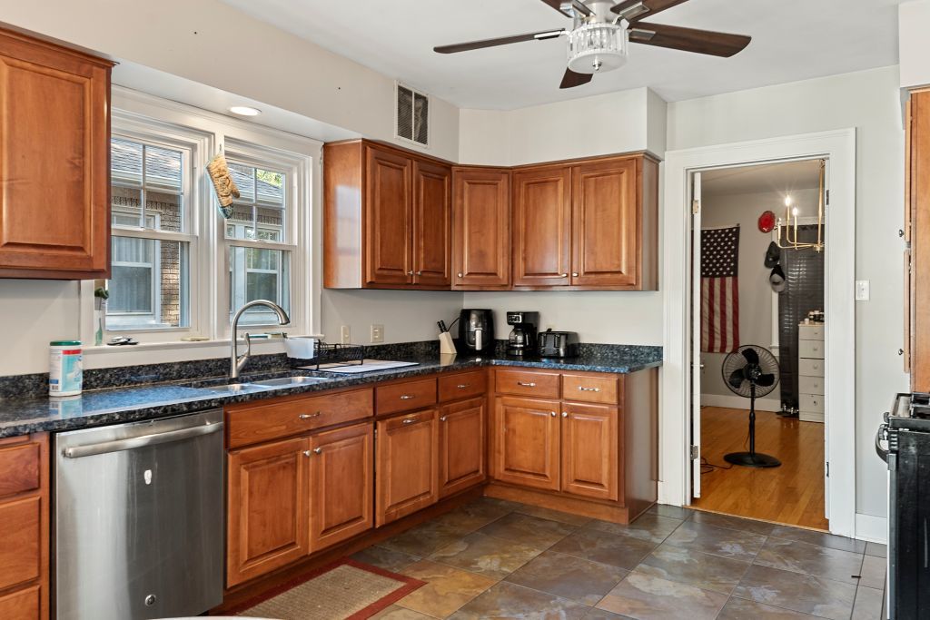 417 South Westlawn Avenue Decatur, IL 62522 - Photo 12 of 40 a kitchen with stainless steel appliances granite countertop a sink and cabinets