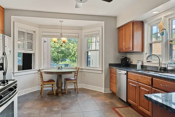 a kitchen with a sink and wooden cabinets