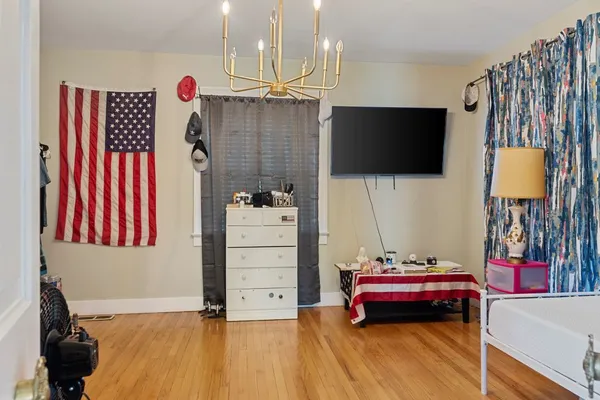 a room with furniture and a flat screen tv