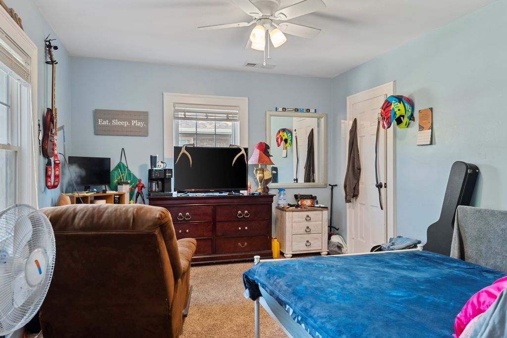 417 South Westlawn Avenue Decatur, IL 62522 - Photo 24 of 40 a living room with furniture and a flat screen tv