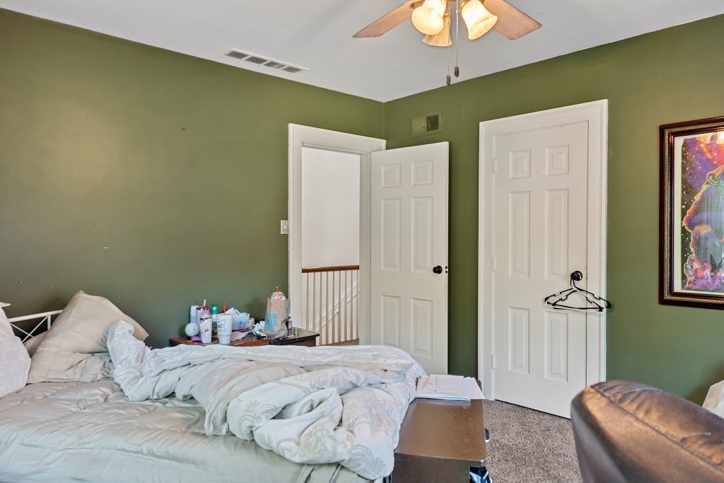 417 South Westlawn Avenue Decatur, IL 62522 - Photo 27 of 40 a bedroom with a bed and a chandelier