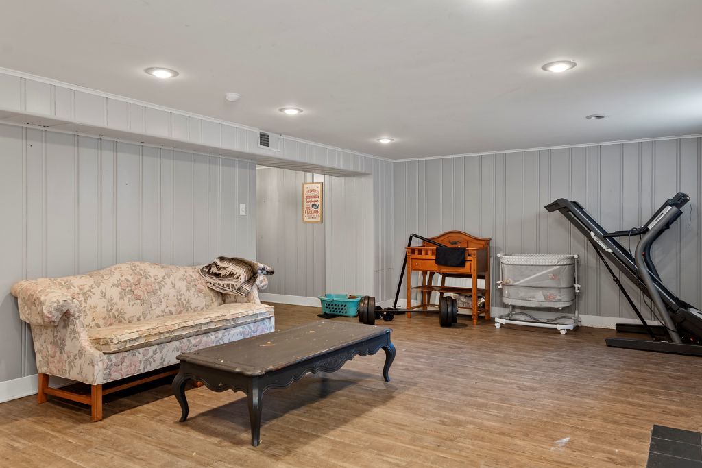 417 South Westlawn Avenue Decatur, IL 62522 - Photo 30 of 40 a living room with furniture gym equipment and a wooden floor
