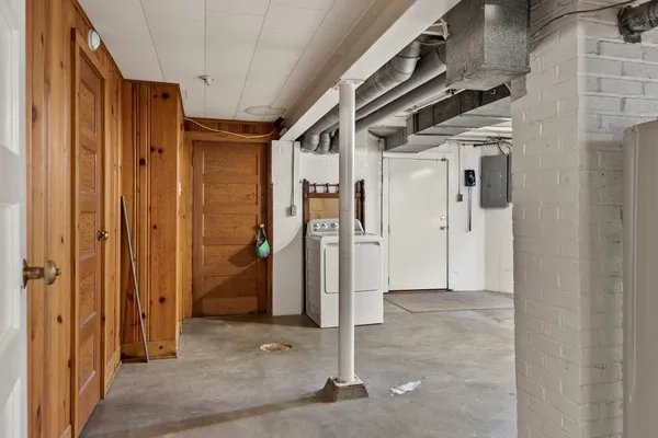 a view of a hallway with wooden shelves