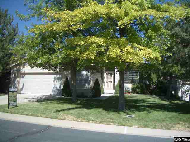 4025 Caughlin Creek Road Reno, NV 89519 - Photo 1 of 5 a front view of house with yard and green space