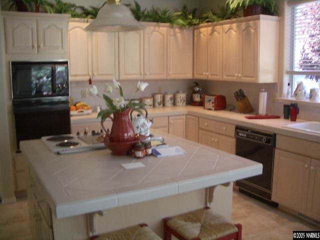 4025 Caughlin Creek Road Reno, NV 89519 - Photo 2 of 5 a kitchen with a sink cabinets and window
