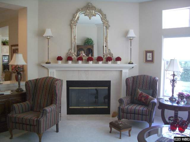 4025 Caughlin Creek Road Reno, NV 89519 - Photo 4 of 5 a living room with furniture and a fireplace