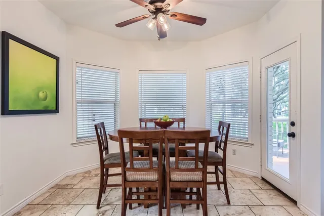 a view of a dining room with furniture and window