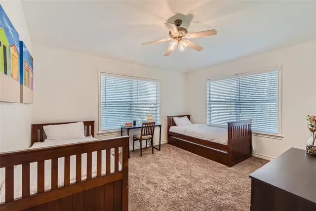a bedroom with furniture and a window