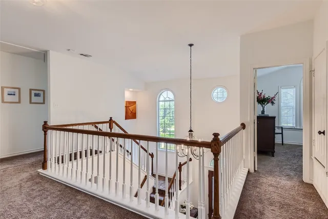 a view of a hallway with windows