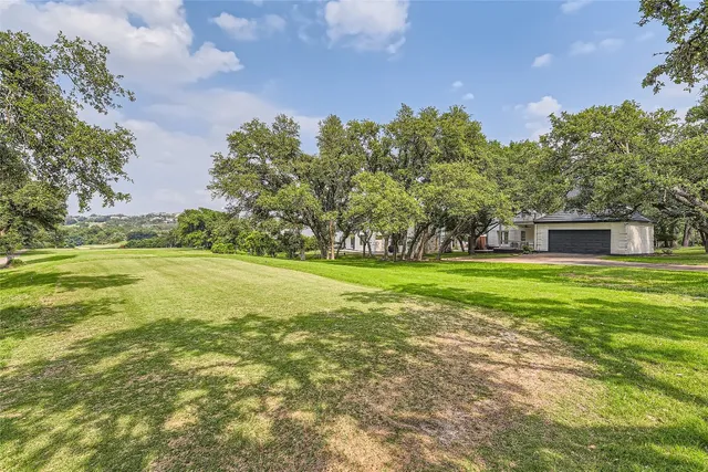 a view of a house with a big yard