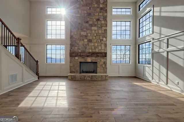 a large kitchen with stainless steel appliances granite countertop a stove and a sink