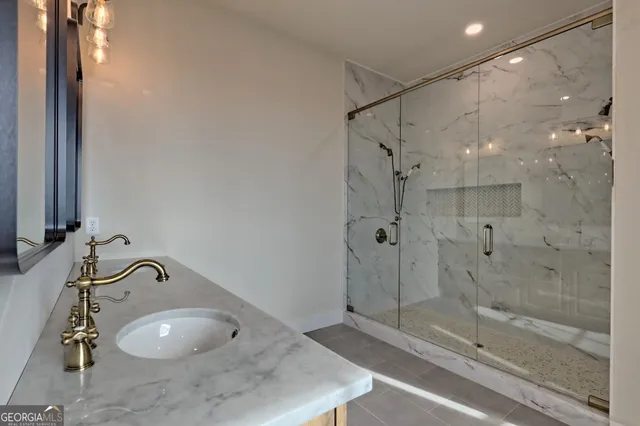 a view of an empty room and wooden floor