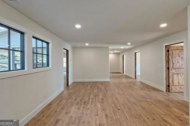 a view of a house with snow on the yard