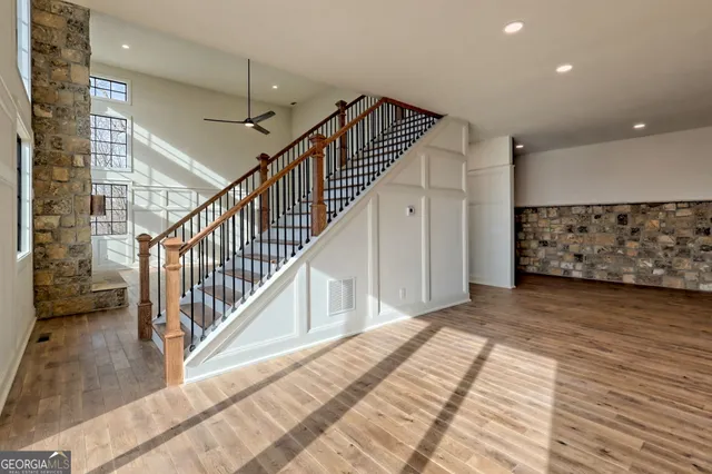 a large kitchen with stainless steel appliances granite countertop a stove a sink and a refrigerator