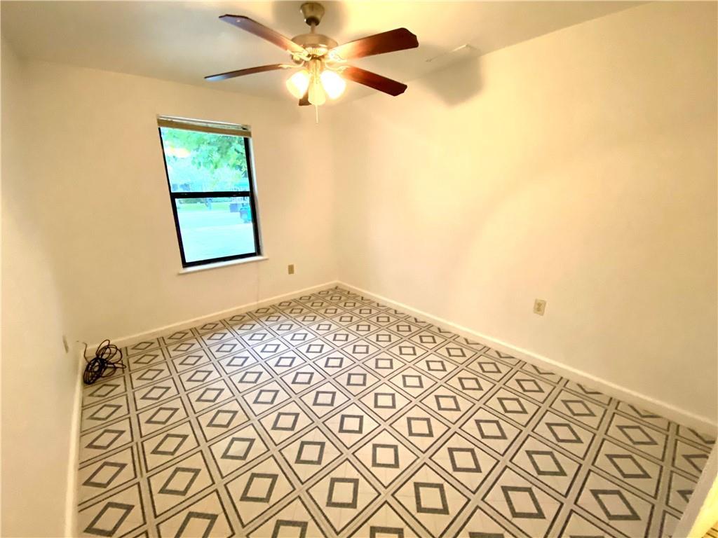 6211 Club Terrace Austin, TX 78741 - Photo 18 of 25 a view of an empty room with a window