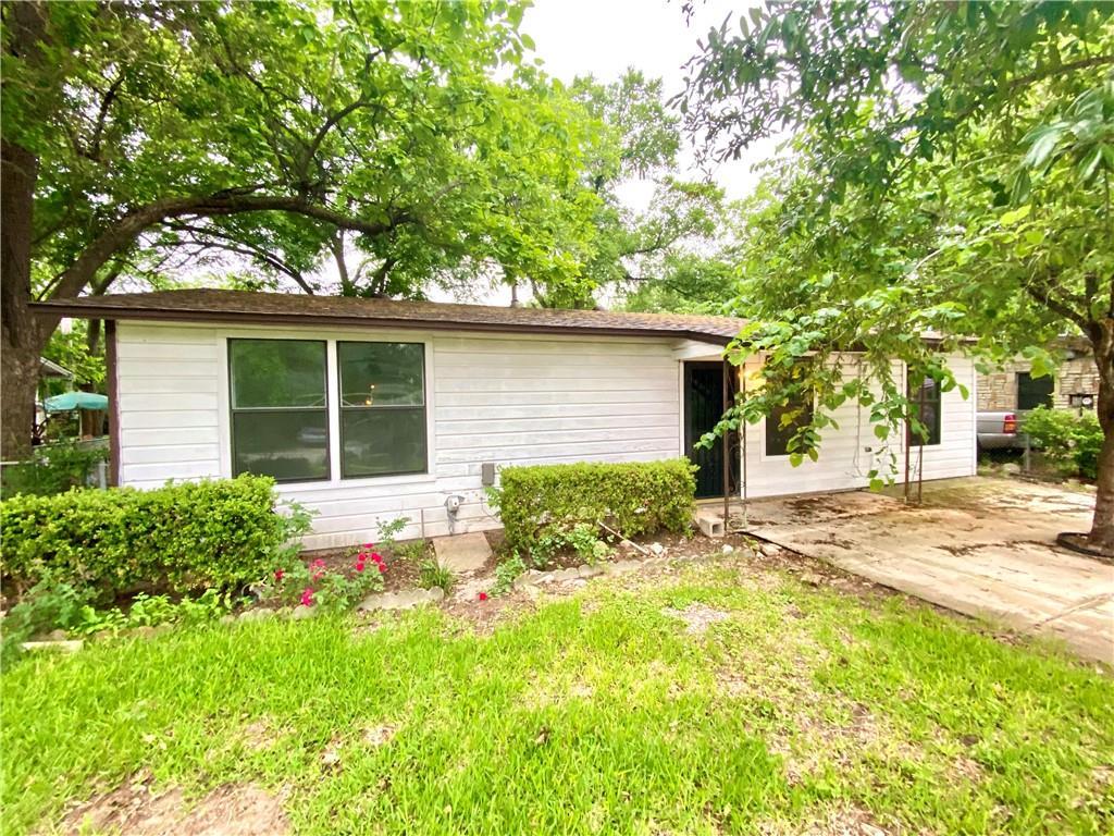 6211 Club Terrace Austin, TX 78741 - Photo 2 of 25 a front view of house with yard and trees around
