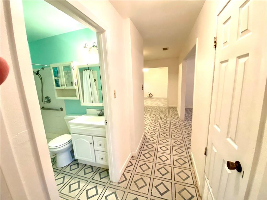 6211 Club Terrace Austin, TX 78741 - Photo 22 of 25 a bathroom with a sink and a mirror