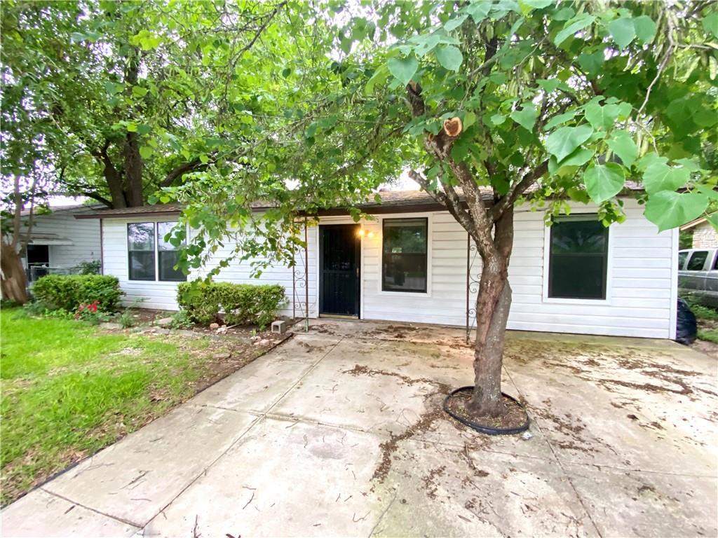 6211 Club Terrace Austin, TX 78741 - Photo 4 of 25 a front view of a house with a tree
