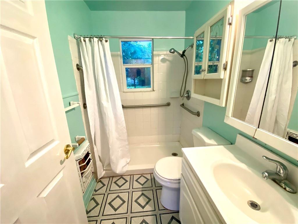 6211 Club Terrace Austin, TX 78741 - Photo 8 of 25 a bathroom with a sink toilet and shower