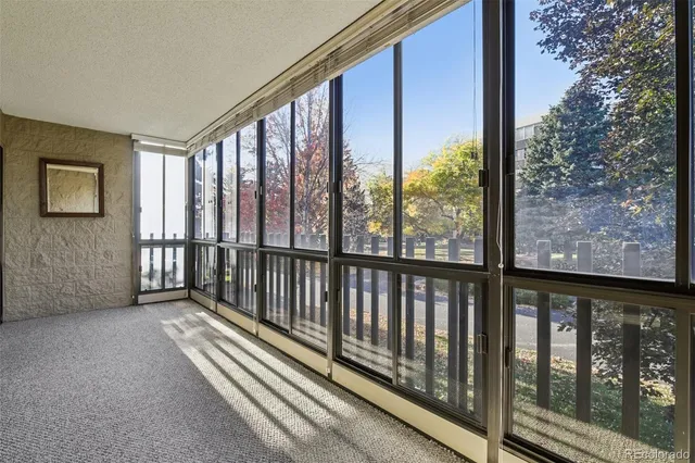 a view of a porch with wooden floor and outdoor space