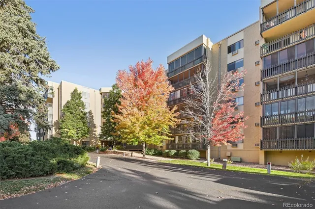 a view of a dining room with furniture and a chandelier
