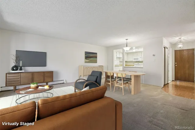 a living room with furniture and a table