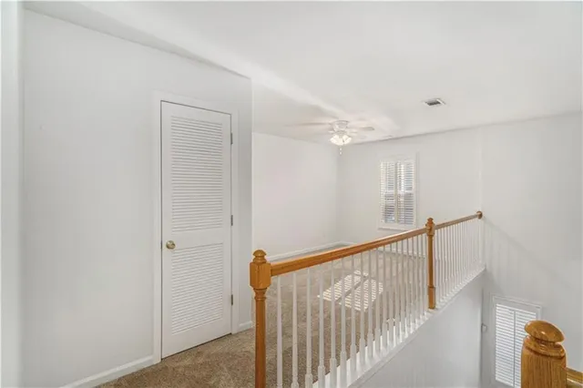 a view of a hallway with closet