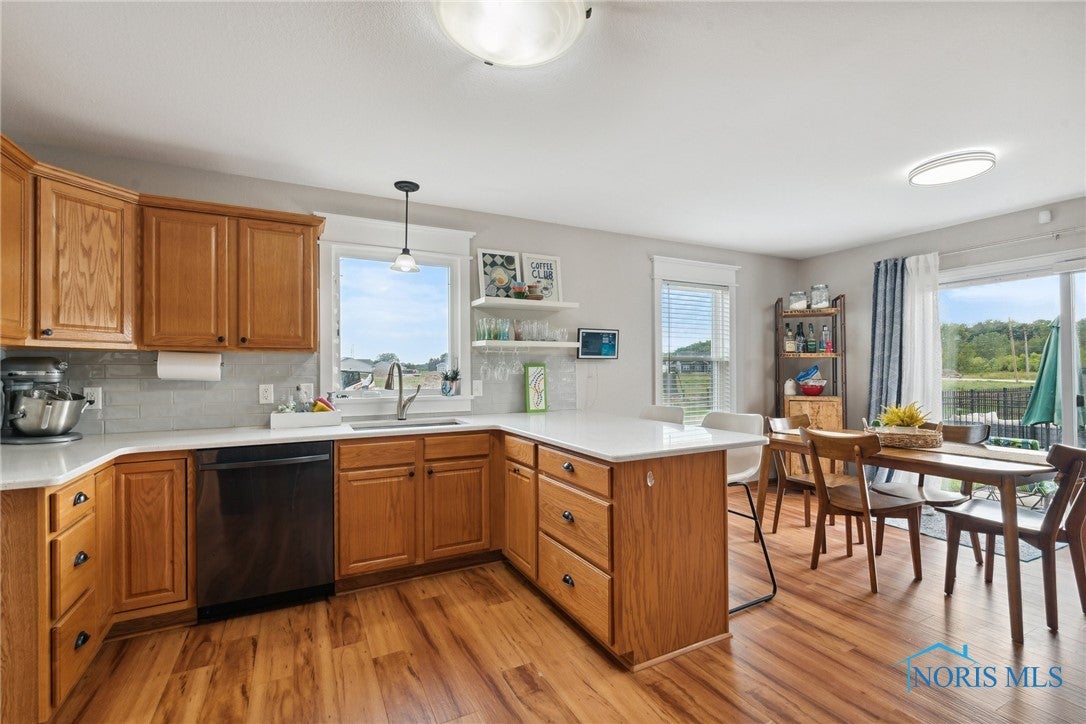 166 Lawai Road Oregon, OH 43616 - Photo 13 of 48 Love the light and views from the kitchen.