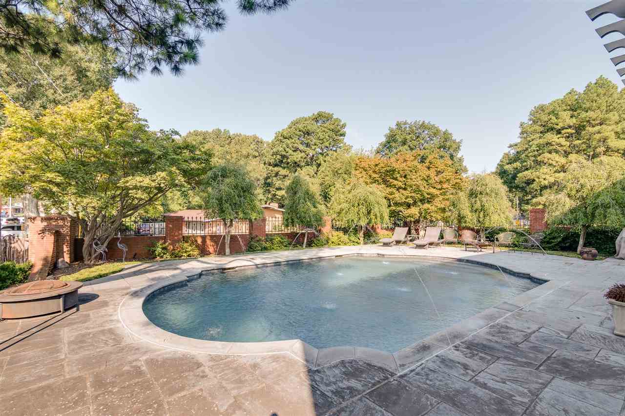 4515 Aldersgate Road, Unit 2 Memphis, TN 38117 - Photo 1 of 25 a view of a swimming pool and trees in the background