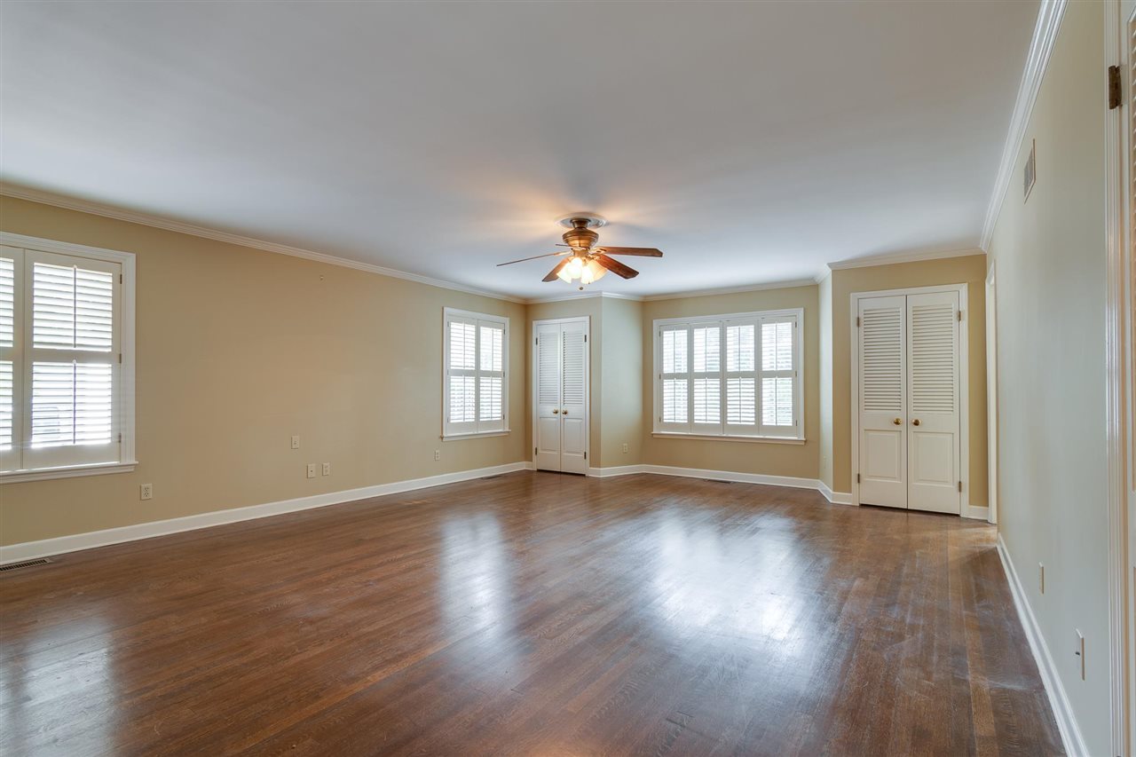 4515 Aldersgate Road, Unit 2 Memphis, TN 38117 - Photo 17 of 25 a view of an empty room with wooden floor and a window