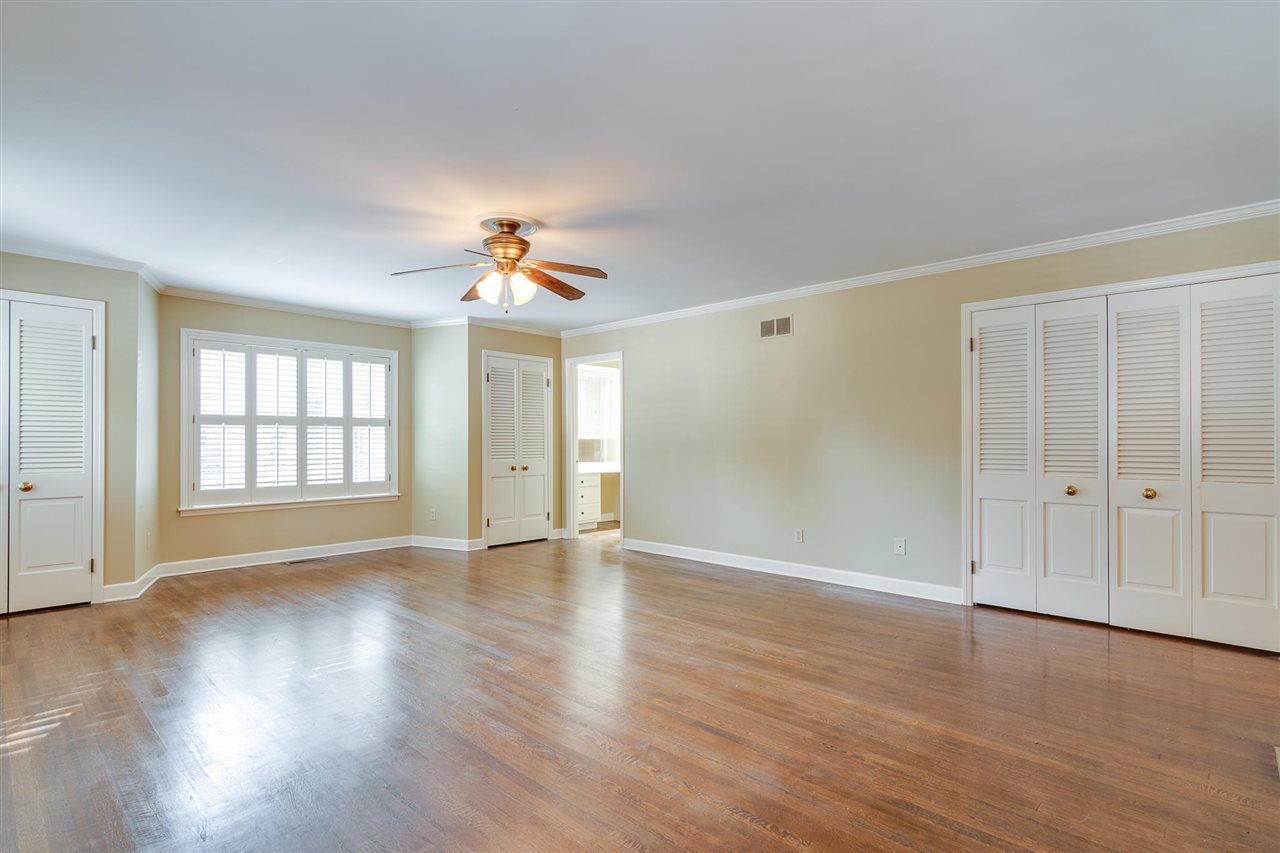 4515 Aldersgate Road, Unit 2 Memphis, TN 38117 - Photo 18 of 25 a view of an empty room with wooden floor and a window