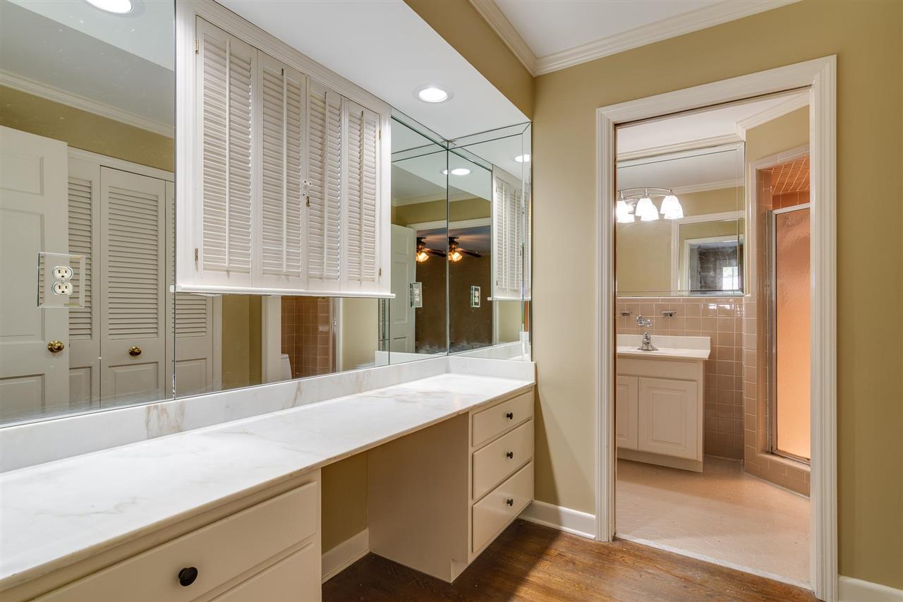 4515 Aldersgate Road, Unit 2 Memphis, TN 38117 - Photo 20 of 25 a spacious bathroom with a shower a sink and a large mirror