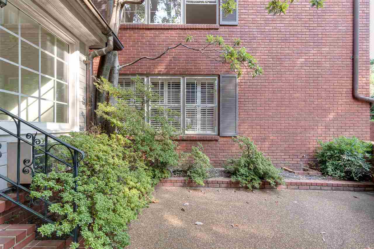 4515 Aldersgate Road, Unit 2 Memphis, TN 38117 - Photo 24 of 25 a front view of a house with a garden