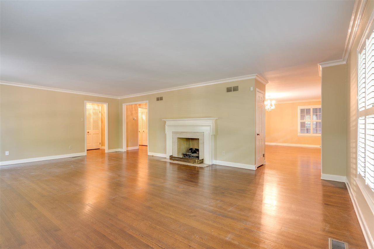 4515 Aldersgate Road, Unit 2 Memphis, TN 38117 - Photo 7 of 25 a view of an empty room with window and wooden floor