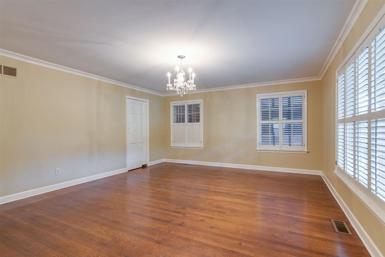 4515 Aldersgate Road, Unit 2 Memphis, TN 38117 - Photo 8 of 25 a view of an empty room with wooden floor and a window
