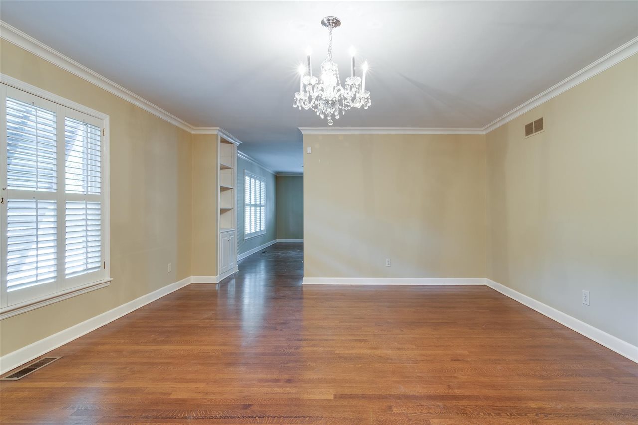 4515 Aldersgate Road, Unit 2 Memphis, TN 38117 - Photo 9 of 25 a view of an empty room with wooden floor and a window