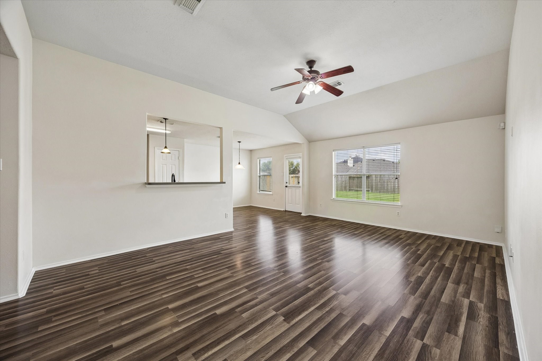 2614 Balsam Ridge Way Fresno, TX 77545 - Photo 3 of 14 a view of an empty room with a window and wooden floor